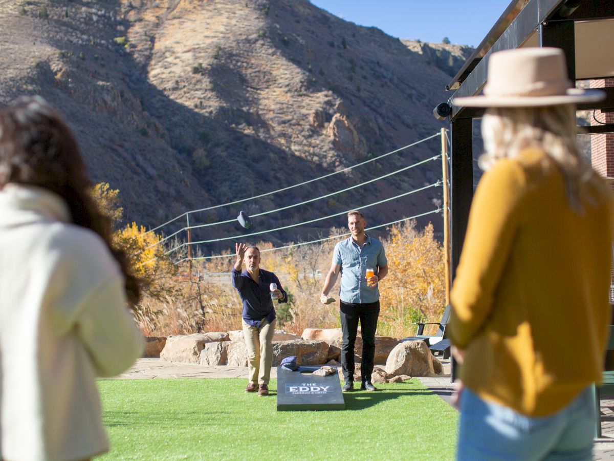 people playing corn hole