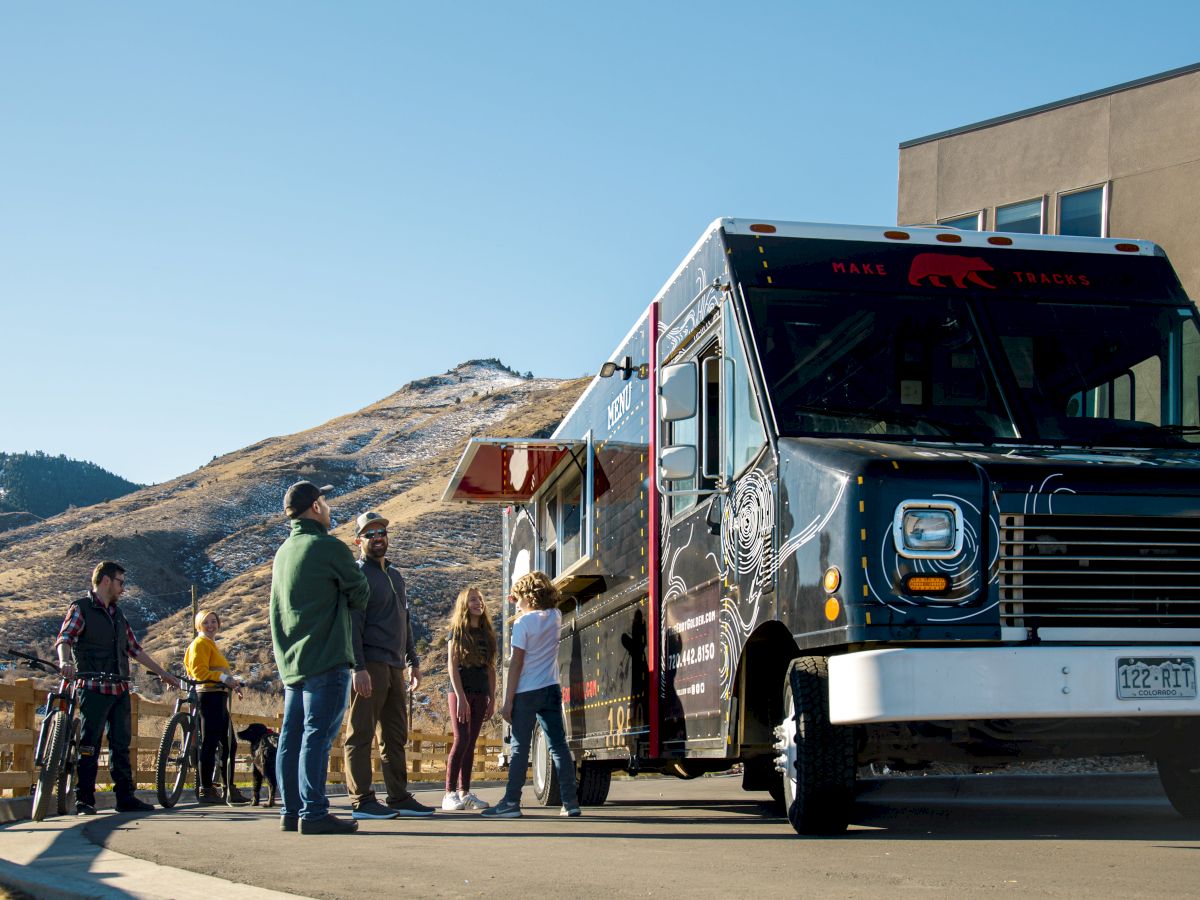 people ordering food from the eddy truck