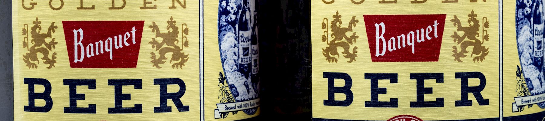 Two bottles of Coors Golden Banquet Beer, each containing 12 fluid ounces.