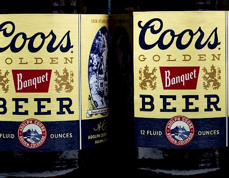 Two bottles of Coors Golden Banquet Beer, each containing 12 fluid ounces.