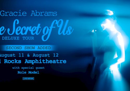 Concert poster for "The Secret of Us Deluxe Tour" by Gracie Abrams, with dates at Red Rocks Amphitheatre and guest Role Model.