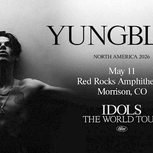 A grayscale concert poster for YUNGBLUD&rsquo;s North America 2026 tour, featuring a shirtless man arms outstretched, event details in the center and &ldquo;IDOLS THE WORLD TOUR&rdquo; at bottom.