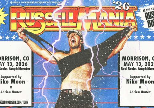 A wrestling concert flyer for Russellmania, featuring a muscular performer on stage with arms raised, lightning effects, and event details in Morrison, CO. The design is bold with red-yellow text and starry blue background, labeled &ldquo;RUSSELLMANIA.&rdquo;
