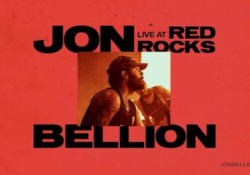 A red concert poster featuring Jon Bellion performing live at Red Rocks, with bold black text and a small photo in the center.