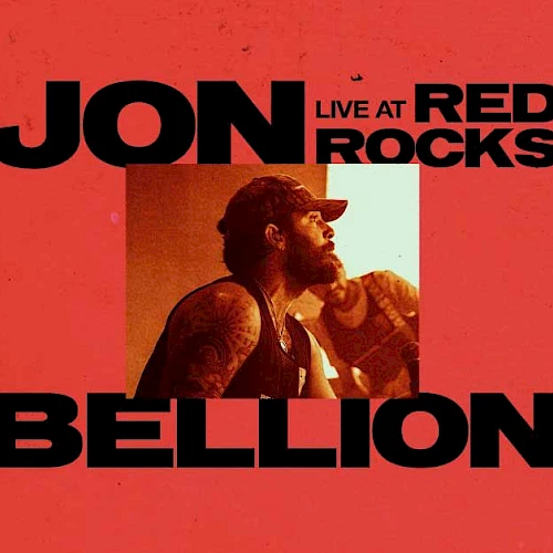 A red concert poster featuring Jon Bellion performing live at Red Rocks, with bold black text and a small photo in the center.