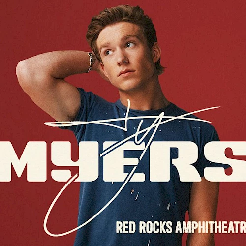 A poster for a Mylers show called &ldquo;Myers&rdquo; featuring a young man with a blue shirt on a red background, with tour details in white text.